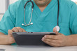 Doctor working on a digital tablet