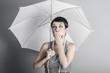 Photo: Surprise, Pin up lady with umbrella, retro and vintage image Surprise, Pin up lady with umbrella, retro and vintage image