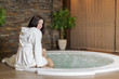 Young woman in the hot tub
