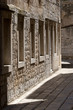 Narrow stone street between old houses in town Vis in Croatia