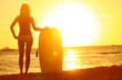 Sunset at summer beach with body surfer woman