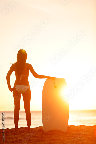 Photo: Summer surfer beach woman vacation sunset Summer surfer beach woman vacation sunset