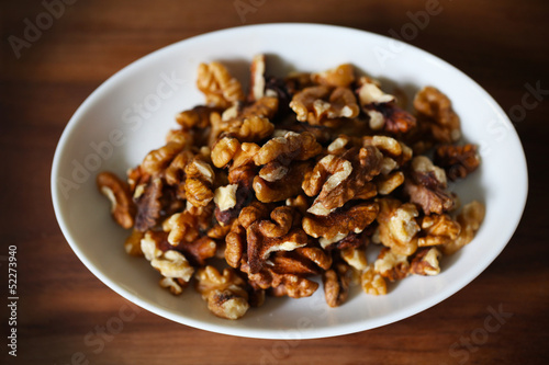 Photo: Walnuts, shelled fruit on white plate, food ingredient Walnuts, shelled fruit on white plate, food ingredient
