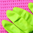 Pink sponge and green rubber glove