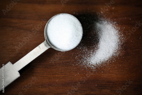 Photo: Baking soda or sodium bicarbonate in a tea spoon and dusted Baking soda or sodium bicarbonate in a tea spoon and dusted