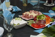 fresj salads and tzatziki on a well decorated table
