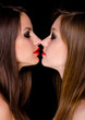 Profiles of two beautiful girls being intimate