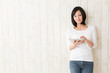 beautiful asian woman using tablet computer