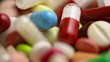 Closeup of medicine and pills turning