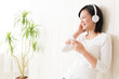 beautiful asian woman listening music