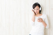 beautiful asian woman listening music