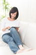 beautiful asian woman using tablet computer