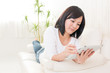 beautiful asian woman using tablet computer