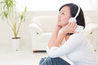 beautiful asian woman listening music