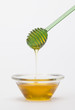 full honey pot and honey stick