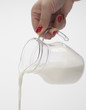 pouring of milk from jug