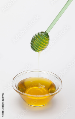 Photo: full honey pot and honey stick full honey pot and honey stick