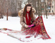 woman cleans rug with snow