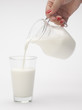 pouring of milk from jug into a ...