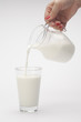 pouring of milk from jug into a ...