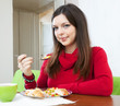 Brunette woman having dinner