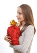 young woman with gift sack, isolated on white