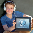 Cute boy showing tablet with multimedia symbols.