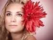 Photo: Blond girl with red flower Blond girl with red flower