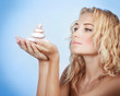 Cute woman with spa stones