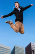 Photo: Shouting boy jumping in city. Shouting boy jumping in city.