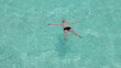 The boy relaxes in pool