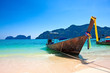 Foto: Traditional wooden boat at Phi Phi island, Thailand, Asia. Traditional wooden boat at Phi Phi island, Thailand, Asia.