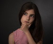 teen posing and improvising over black backdrop