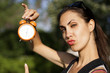 Young woman with clock