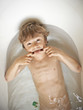 Boy making a funny face in bath