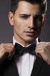 Close-up portrait of a young handsome man with bow tie