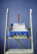 ladder, paint can and paint roller