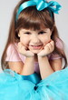 Little Smiling Girl Hands under Chin Portrait