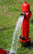 powerful water flow coming out with impetus from a street hydran