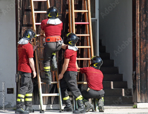 Photo: exercise and training of firefighters in the fire station with w exercise and training of firefighters in the fire station with w