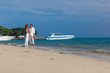 couple in white on the beach