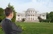 man looking at his dream house