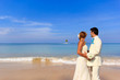 Photo: young couple get married on the beach young couple get married on the beach