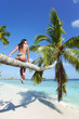 Photo: Woman on palm on sea backgroud Woman on palm on sea backgroud