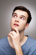 Young man wondering