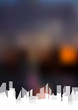 Dark blurred background with white city.