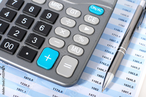 Photo: Calculator and pen. Calculator and pen.