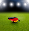 Foto: Stadion mit Schiedsrichterpfeife Stadion mit Schiedsrichterpfeife