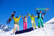 Foto: Fiends with snowboard in mountains Fiends with snowboard in mountains