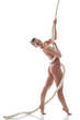 Pretty nude model posing with rope in studio